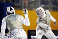 Jul 22, 2015; Toronto, Ontario, CAN; Gerek Meinhardt of the United States (left) fences Alexander Massialas of the United States in the men’s fencing individual foil final during the 2015 Pan Am Games at Pan Am Aquatics UTS Centre and Field House. Mandatory Credit: Jeff Swinger-USA TODAY Sports