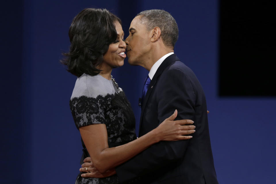 President Barack Obama kisses his wife Michelle after the third presidential debate at Lynn University, Monday, Oct. 22, 2012, in Boca Raton, Fla. (AP Photo/Charlie Neibergall)