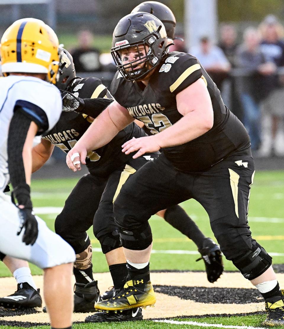 Senior lineman Kyle Guarino of Western Wayne (52) looks to protect his quarterback during Lackawanna Football Conference action.