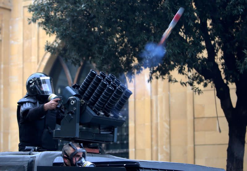 Lebanese police fires tear gas during a protest seeking to prevent MPs and government officials from reaching the parliament for a vote of confidence, in Beirut
