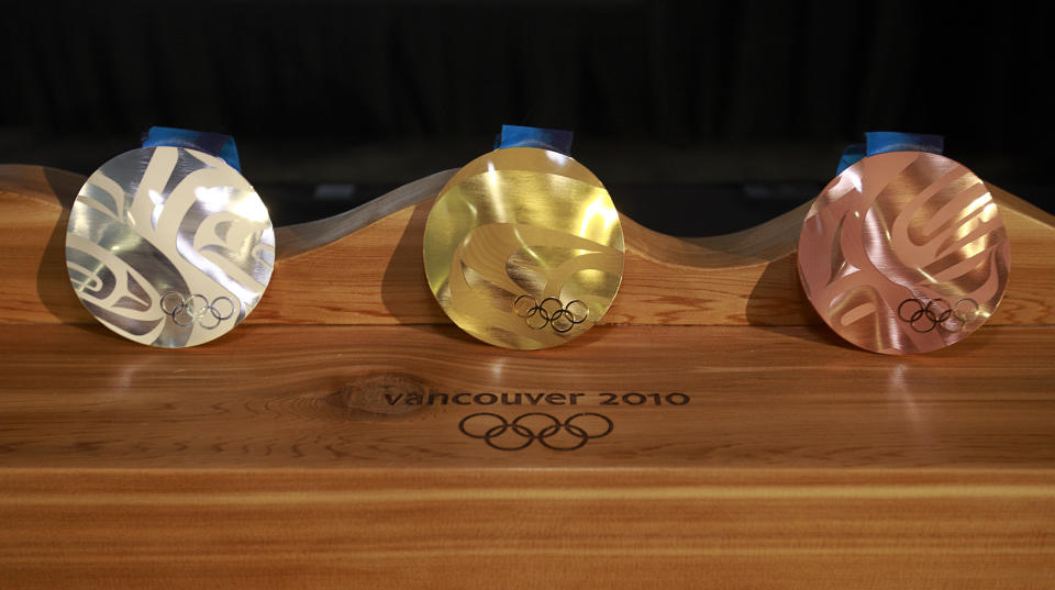 <p>The Vancouver 2010 medals were inspired by the snow, seas, and landscape of British Columbia. The wavy shape is a first, and <a rel="nofollow noopener" href="http://www.mint.ca/store/mint/learn/medals-the-story-4400010#.WobdoxPwZTY" target="_blank" data-ylk="slk:each medal is unique;elm:context_link;itc:0;sec:content-canvas" class="link ">each medal is unique</a>.<br>(Photo by Jeff Vinnick/Getty Images) </p>