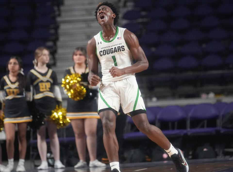 Phoenix Christian Cougars guard Tommy Randolph (1) celebrates his shot against the Highland Prep Honey Badgers at Arizona Veterans Memorial Coliseum on Feb. 24, 2023.