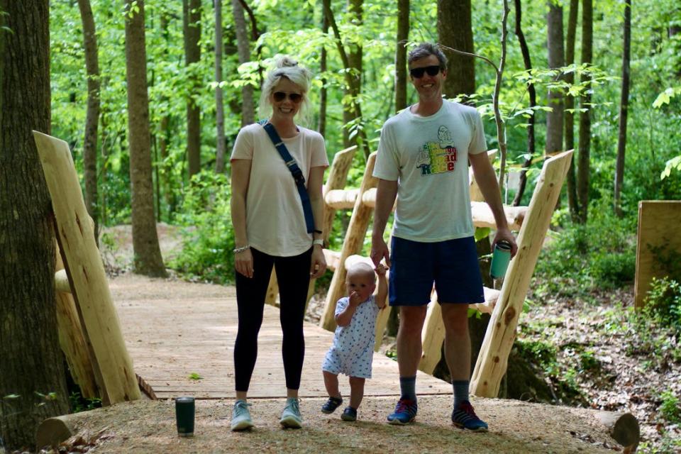 Family crosses new bridge built at Rocky Branch Park, which will be part of a 20-mile trail from the South Carolina state line to Ranlo.