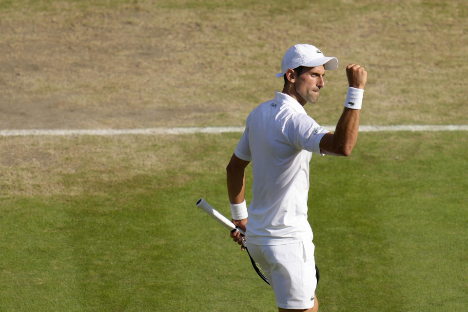 Serbia's Novak Djokovic reacts as he plays Britain's Cameron Norrie in a men's singles semifinal on day twelve of the Wimbledon tennis championships in London, Friday, July 8, 2022. (AP Photo/Kirsty Wigglesworth)