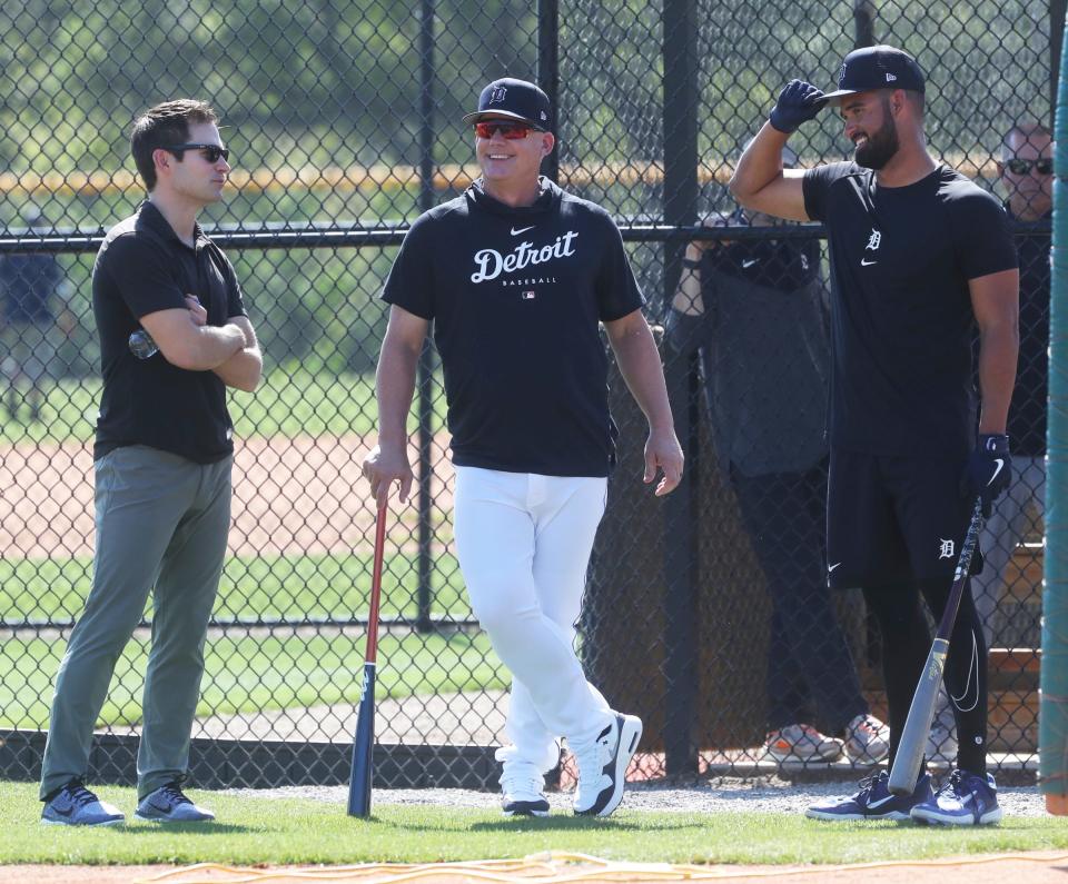 Tigers president of baseball operations Scott Harris, manager A.J. Hinch and outfielder Riley Greene talk at the batting cage  during spring training on Friday, Feb. 17, 2023, in Lakeland, Florida.