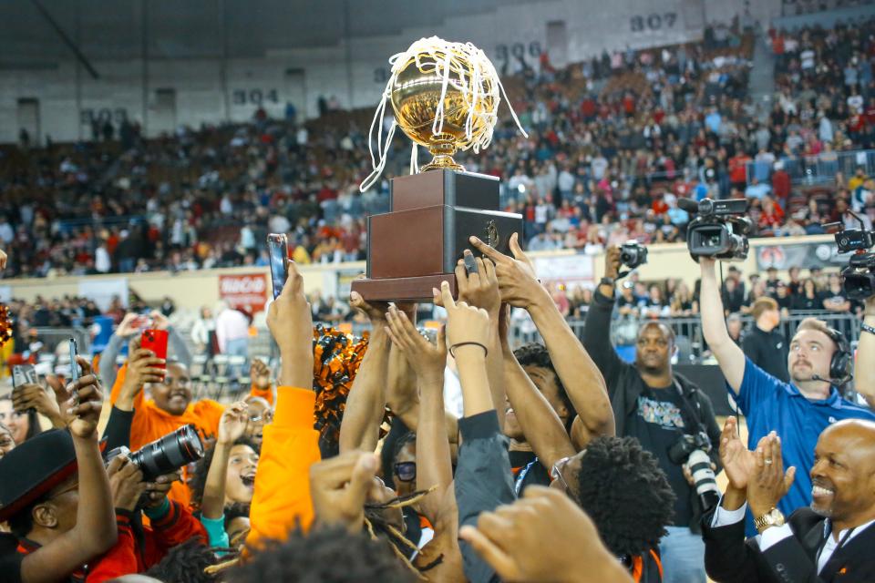 Douglass players celebrate after beating Weatherford for the Class 4A championship Saturday at State Fair Arena.