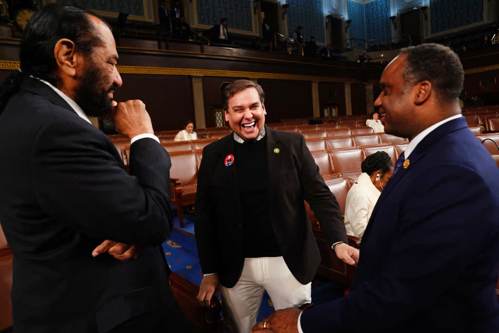 Former Republican Rep. George Santos (center) chats with Democratic Reps. Al Green and Joe Negus ahead of President Joe Biden’s State of the Union address in the House Chamber of the U.S. Capitol in Washington