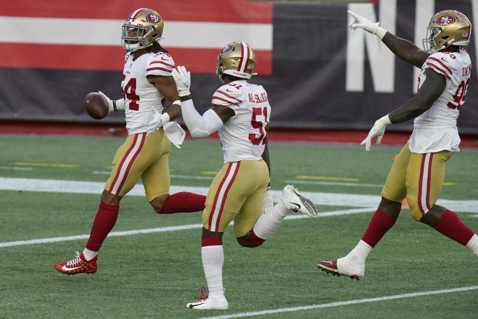 San Francisco 49ers linebacker Fred Warner, left, celebrates his interception with teammates in the first half of an NFL football game against the New England Patriots, Sunday, Oct. 25, 2020, in Foxborough, Mass. (AP Photo/Steven Senne)