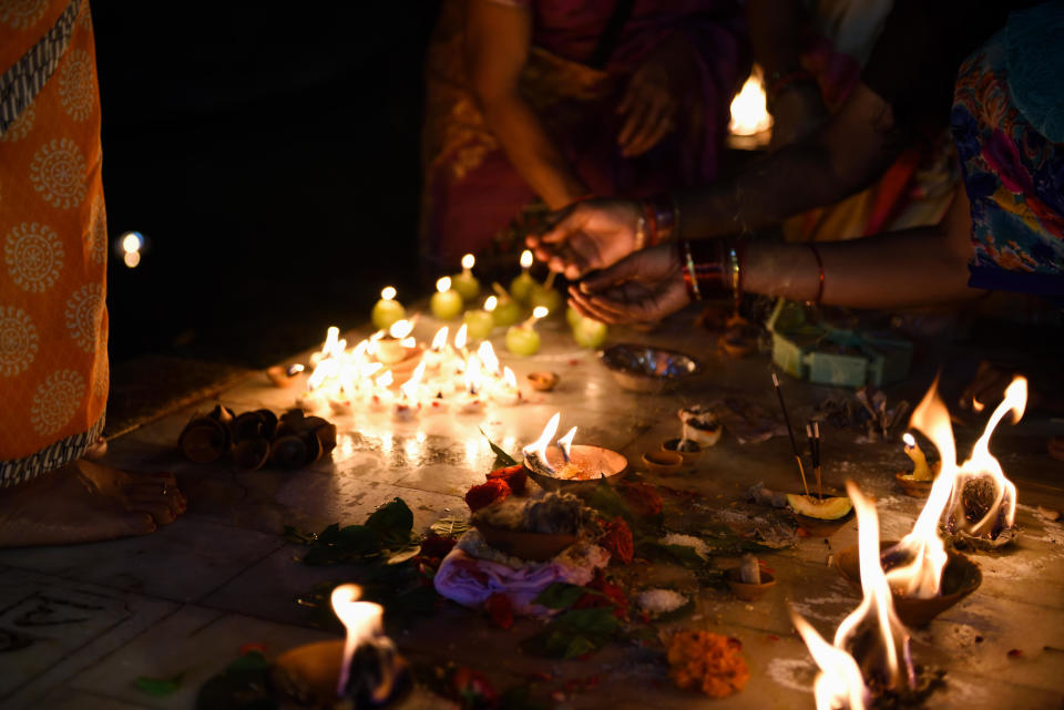 A file photo shows people lighting candles for a Hindu religious ceremony during a Dev Diwali festival  in Varanasi, India. / Credit: Getty/iStockphoto