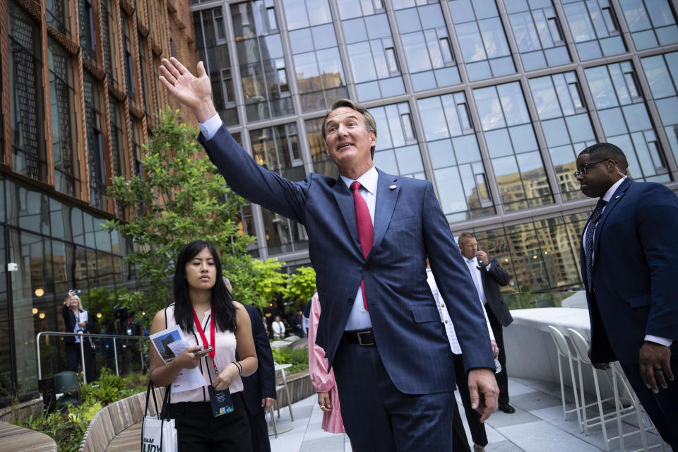 Virginia Governor Glenn Youngkin waves as he tours Amazon HQ2 during their grand opening ceremony on June 15, 2023 in Arlington, Virginia.  / Credit: Drew Angerer / Getty Images