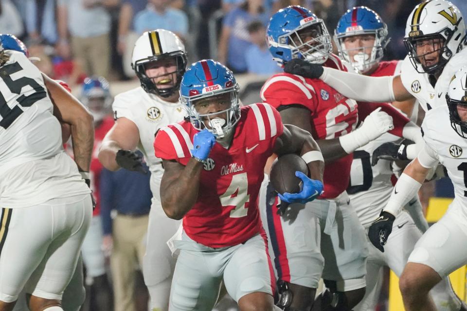 Mississippi running back Quinshon Judkins (4) runs past Vanderbilt defenders for a 40-yard gain during the first half of an NCAA college football game in Oxford, Miss., Saturday, Oct. 28, 2023. Mississippi won 33-7. (AP Photo/Rogelio V. Solis)