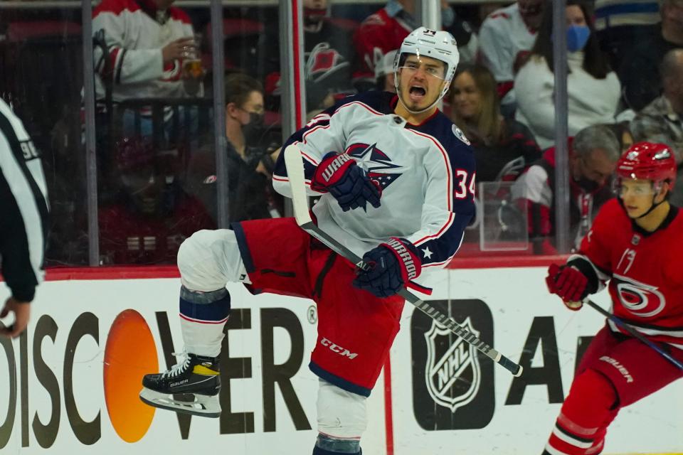 Jan 13, 2022; Raleigh, North Carolina, USA;  Columbus Blue Jackets center Cole Sillinger (34) celebrates his goal against the Carolina Hurricanes during the third period at PNC Arena. Mandatory Credit: James Guillory-USA TODAY Sports