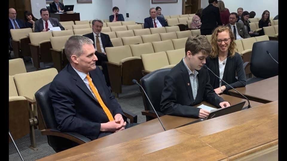 Ben Kredich testifies to the Senate Education Committee as his parents look on in 2019. When he started at UT he was not permitted to live in campus housing. State Sen. Becky Duncan Massey sponsored legislation to overturn this rule.