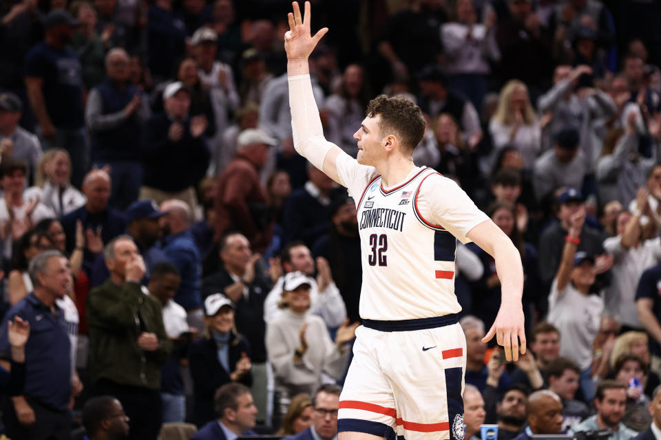 BOSTON, MASSACHUSETTS - MARCH 30: Donovan Clingan #32 of the Connecticut Huskies celebrates a point against the Illinois Fighting Illini during second half in the Elite Eight round of the 2024 NCAA Men's Basketball Tournament held at TD Garden on March 30, 2024 in Boston, Massachusetts. (Photo by Jamie Schwaberow/NCAA Photos via Getty Images)