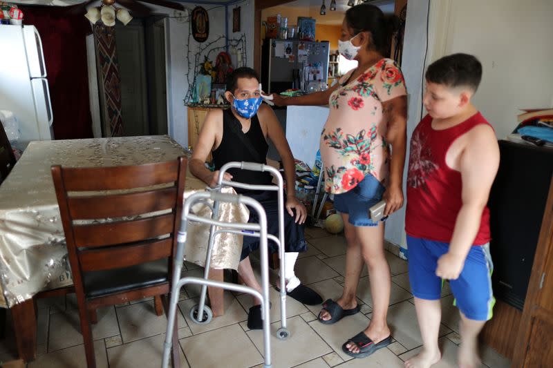 Francisco Garcia, 31, who spent almost four months in hospital with COVID-19, recovers at his home in Los Angeles