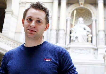 Austrian data activist Max Schrems stands in the courthouse after his trial against Facebook in Vienna April 9, 2015. REUTERS/Leonhard Foeger