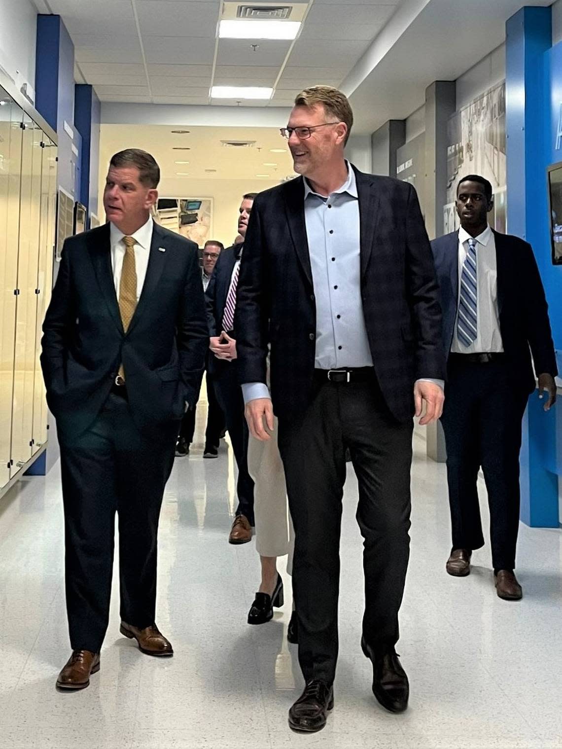 U.S. Secretary of Labor Marty Walsh, left, tours part of Micron’s campus with Scott J. DeBoer, the memory-chip maker’s executive vice president of technology..