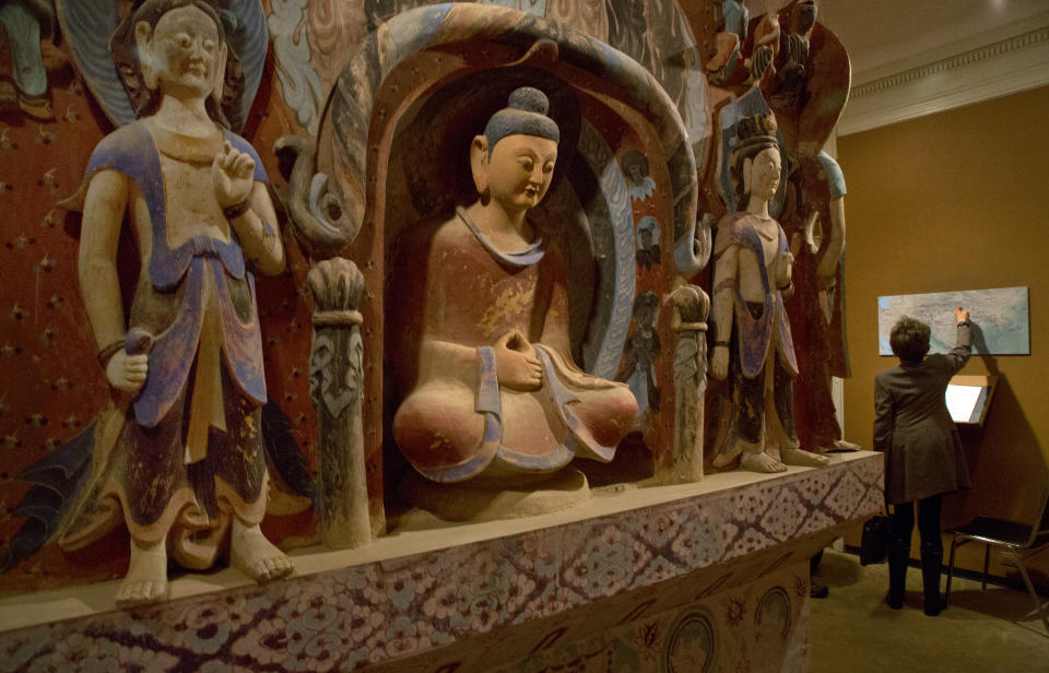 The central pillar of Mogao Cave 432, from the Western Wei Dynasty, 535-556 AD, is presented in "Dunhuang: Buddhist Art at the Gateway of the Silk Road," at the China Institute, in New York, Tuesday, April 24, 2013. (AP Photo/Richard Drew)