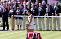 France's Marion Bartoli with the trophy after beating Germany's Sabine Lisicki during day twelve of the Wimbledon Championships at The All England Lawn Tennis and Croquet Club, Wimbledon.