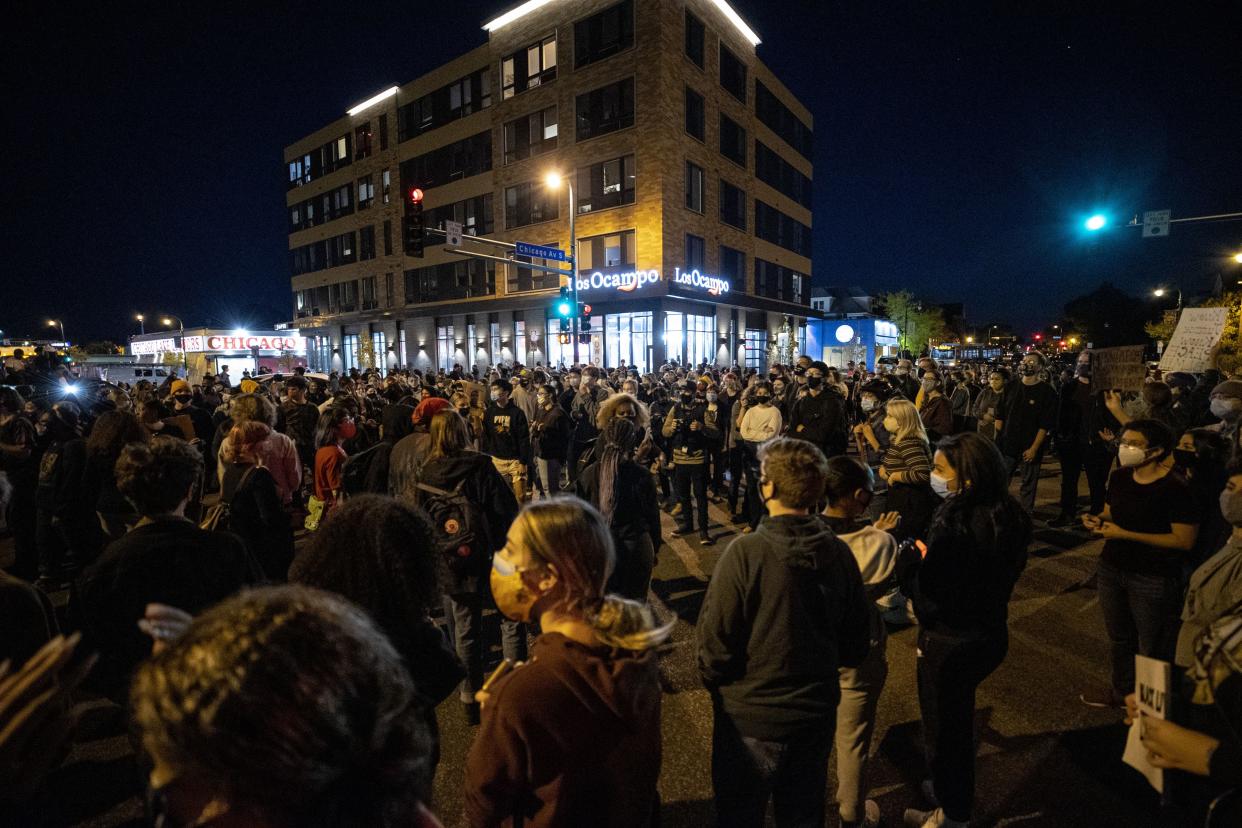 Protesters block an intersection in Minneapolis on Wednesday, Oct. 7, 2020, after Derek Chauvin, the former Minneapolis police officer charged with murder in the death of George Floyd, posted bail and was released from prison.