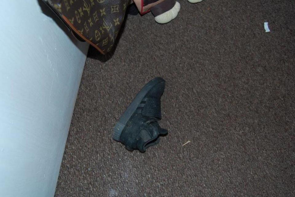 One of the victim's shoes, found at his home (PA)