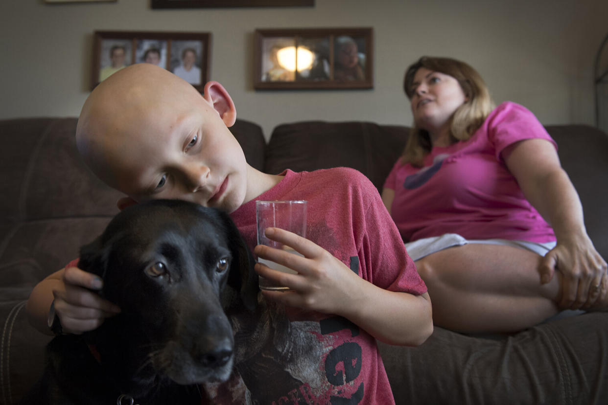 Trevor Beckermann and his mother, Meagan Beckermann, pictured in 2017 at their home near the West Lake Landfill, a Superfund site, in greater St. Louis, Missouri. The family blames the child's autoimmune disease on exposure to toxic contaminants at the site.  (Photo: The Washington Post via Getty Images)