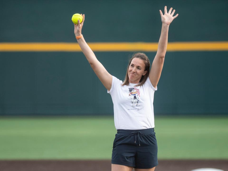 Monica Abbott waves to the crowd before throwing the ceremonial first pitch for the Tennessee and Vanderbilt NCAA college baseball game in Knoxville, Tenn. on Friday, April 21, 2023.