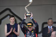 Red Bull driver Max Verstappen of the Netherlands celebrates with his trophy on the podium after winning the Monaco Formula One Grand Prix, at the Monaco racetrack, in Monaco, Sunday, May 28, 2023. (AP Photo/Luca Bruno)