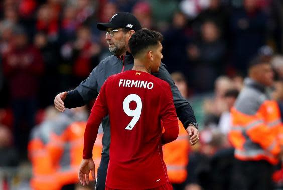 Firmino and Klopp embrace for Liverpool (Getty Images)