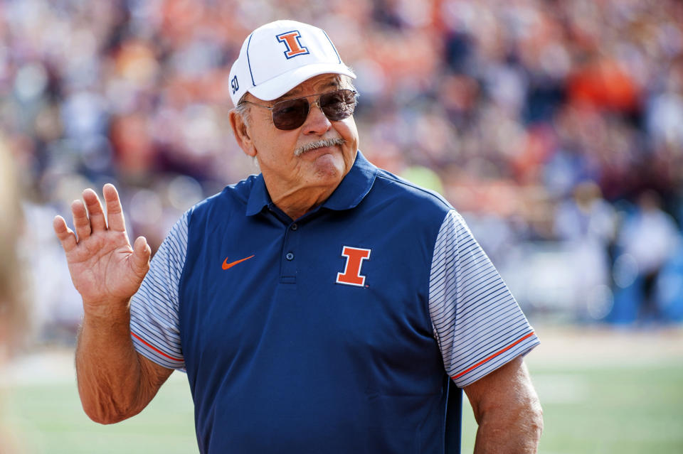 FILE - Dick Butkus, former Illinois and Chicago Bears linebacker, waves during a timeout as the first inductee of the Illinois Athletics Hall of Fame, during Illinois' NCAA college football game against Minnesota, Oct. 29, 2016, at Memorial Stadium in Champaign, Ill. Butkus, a fearsome middle linebacker for the Bears, has died, the team announced Thursday, Oct. 5, 2023. He was 80. According to a statement released by the team, Butkus' family confirmed that he died in his sleep overnight at his home in Malibu, Calif. (AP Photo/Bradley Leeb, File)