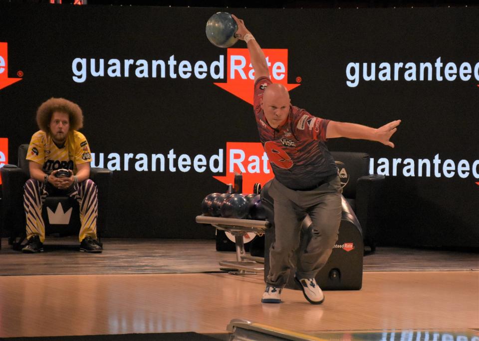 PBA bowler Tommy Jones winds up for his throw down the lane in the fourth game of the PBA Playoff finals as opponent Kyle Troup looks on May 15, 2022.