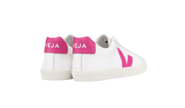 White sneakers with pink logo