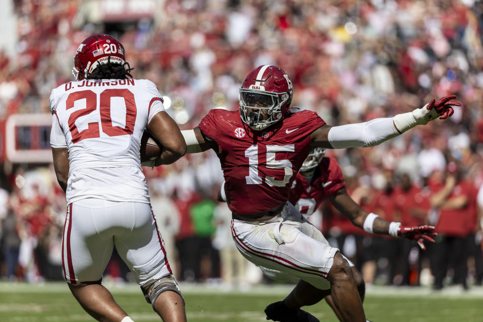 FILE - Alabama linebacker Dallas Turner (15) pursues Arkansas running back Dominique Johnson (20) during the second half of an NCAA college football game, Saturday, Oct. 14, 2023, in Tuscaloosa, Ala. Turner has been selected to The Associated Press midseason All-America team, Wednesday, Oct. 18, 2023.(AP Photo/Vasha Hunt, File)