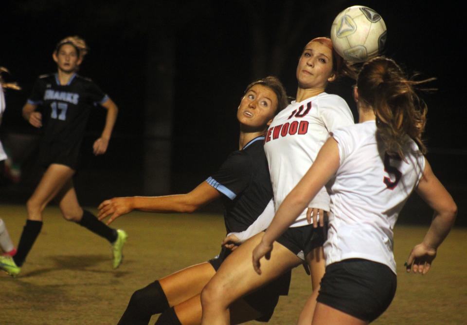 Edgewood midfielder Andrea Toledo (10) heads the ball away from Ponte Vedra forward Natalie Brooks (2) in a high school girls soccer game on December 15, 2023. [Clayton Freeman/Florida Times-Union]