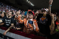 Supporters of President Donald Trump cheer as he arrives to speak during a campaign rally at Veterans Memorial Coliseum, Wednesday, Feb. 19, 2020, in Phoenix. (AP Photo/Evan Vucci)