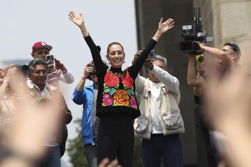FILE - Former Mayor Claudia Sheinbaum acknowledges supporters during a closing campaign rally for her presidential candidate bid to represent the ruling MORENA party, in Mexico City, Saturday, Aug. 26, 2023. Mexico looks set to elect its first female president on June 2 -- either Claudia Sheinbaum, a protégé of President Andrés Manuel López Obrador, or tech entrepreneur and lawmaker Xóchitl Gálvez. (AP Photo/Ginnette Riquelme, File)