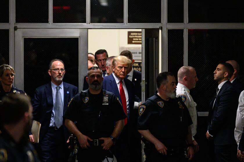 Former US President Donald Trump makes his way inside the Manhattan Criminal Courthouse in New York on April 4, 2023. - Donald Trump will make an unprecedented appearance before a New York judge on April 4, 2023 to answer criminal charges that threaten to throw the 2024 White House race into turmoil. (Photo by Ed JONES / AFP) (Photo by ED JONES/AFP via Getty Images)