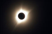 <p>A jet plane flies by the total solar eclipse in Guernsey, Wyoming U.S. August 21, 2017. (Photo: Rick Wilking/Reuters) </p>