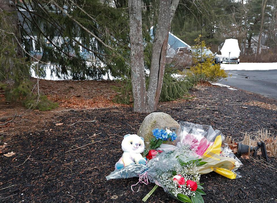 Flowers outside the crime scene on Summer Street in Duxbury Wednesday Jan. 25, 2023.