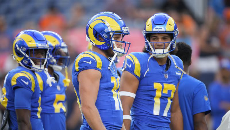 Los Angeles Rams wide receiver Cooper Kupp (10) chats with Los Angeles Rams wide receiver Puka Nacua (17) as they warm up before an NFL preseason football game Saturday, Aug. 26, 2023, in Denver.