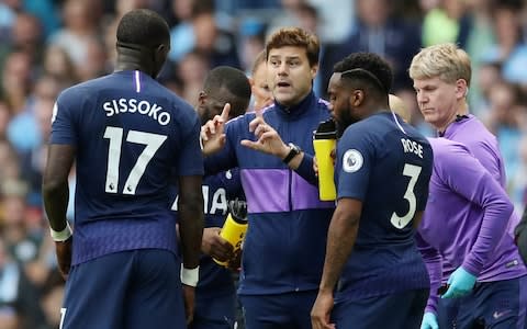 Mauricio Pochettino gives instructions to Moussa Sissoko and Danny Rose during a break in play - Credit: REUTERS