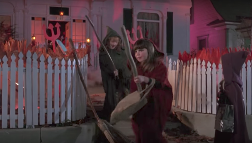 <p>When the Sanderson sisters climb off of the bus, they find themselves in front of "Satan's" house, and leave their broomsticks propped up against the fence outside as they follow him into his house. A few moments later, <a rel="nofollow noopener" href="https://www.youtube.com/watch?v=QMXC_Lgoq5s" target="_blank" data-ylk="slk:three little girls dressed exactly like the witches;elm:context_link;itc:0;sec:content-canvas" class="link ">three little girls dressed exactly like the witches</a> come up and take the brooms, enjoying their first real flight on actual magical broomsticks. It isn't clear whether the girls were dressed as the witches as a cute references to the witches' history in Salem, or if the directors were trying to hint at the possibility of a young Sanderson sisters film. Either way, this scene was awesome and might have even made you wish you could fly on a real broomstick, too, as a kid.</p>