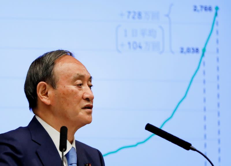 FILE PHOTO: Japanese Prime Minister Yoshihide Suga attends a news conference on Japan's response to the COVID-19 outbreak, in Tokyo