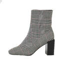 <p><a rel="nofollow noopener" href="https://www.riverisland.com/p/black-check-print-block-heel-sock-boots-706427" target="_blank" data-ylk="slk:River Island;elm:context_link;itc:0;sec:content-canvas" class="link ">River Island</a> – £55 </p>