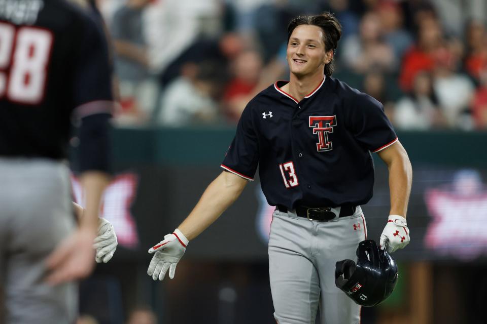 Texas Tech’s Gavin Kash (13) celebrates after hitting his 24th home run of the season during a first-round game against West Virginia in the Big 12 Conference Tournament on Wednesday, May 24, 2023, at Globe Life Field in Arlington, Texas.