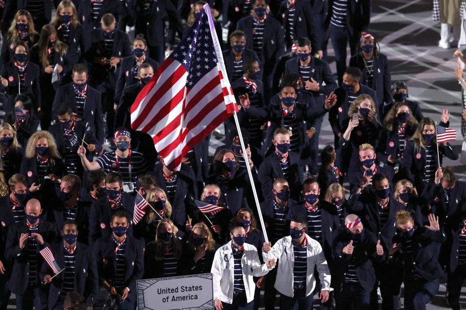 Flag bearers Sue Bird and Eddy Alvares of Team United States