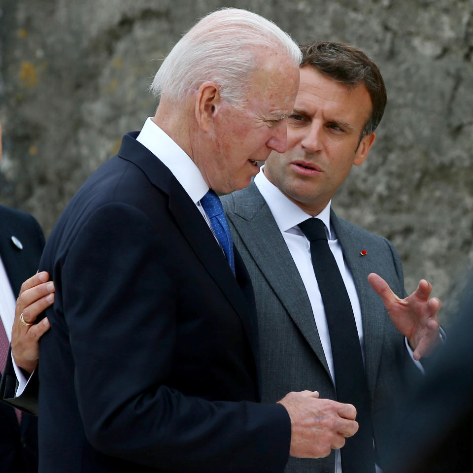 Image: Biden talks with French President Emmanuel Macron on the first day of the G-7 summit (Hollie Adams / Bloomberg via Getty Images file)