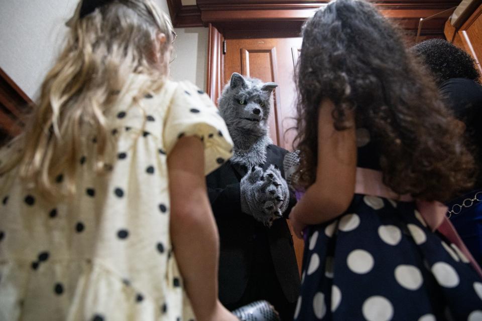 Drake McElyea, portraying The Big Bad Wolf, is interviewed by East Cliff Elementary students, Carrigan Zonkel, and Ava Seay, portraying courtroom reporters, after a mock trial at the Federal Courthouse on Thursday, Nov. 16, 2023, in Corpus Christi, Texas.