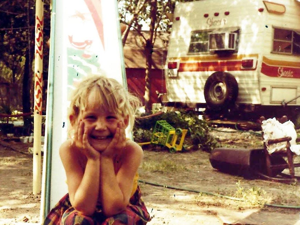 Jenny McDonald as a kid with a trailer in the background