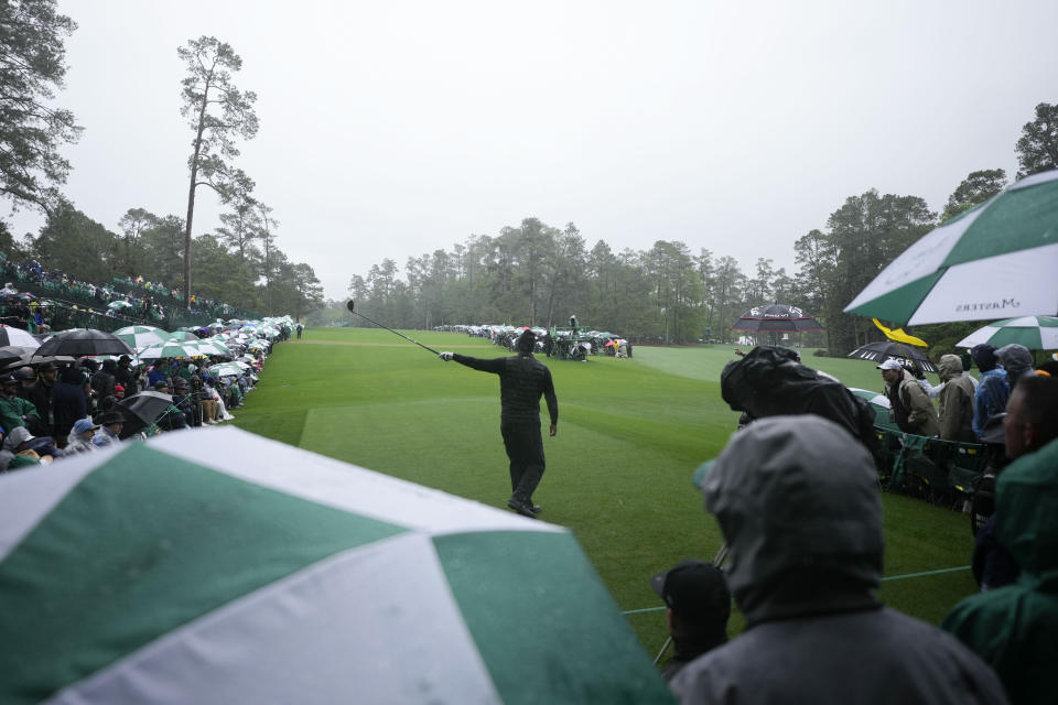Tiger Woods point in the direction of his tee shot on the 14th hole during the weather delayed third round of the Masters golf tournament at Augusta National Golf Club on Saturday, April 8, 2023, in Augusta, Ga. (AP Photo/Matt Slocum)
